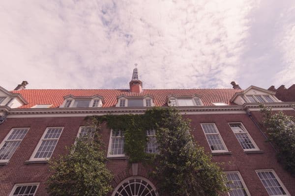 Ivy-Clad Brick Facade Under Mackerel Sky
